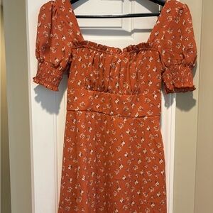 TRIXXI clothing company.  Dark orange and floral dress.